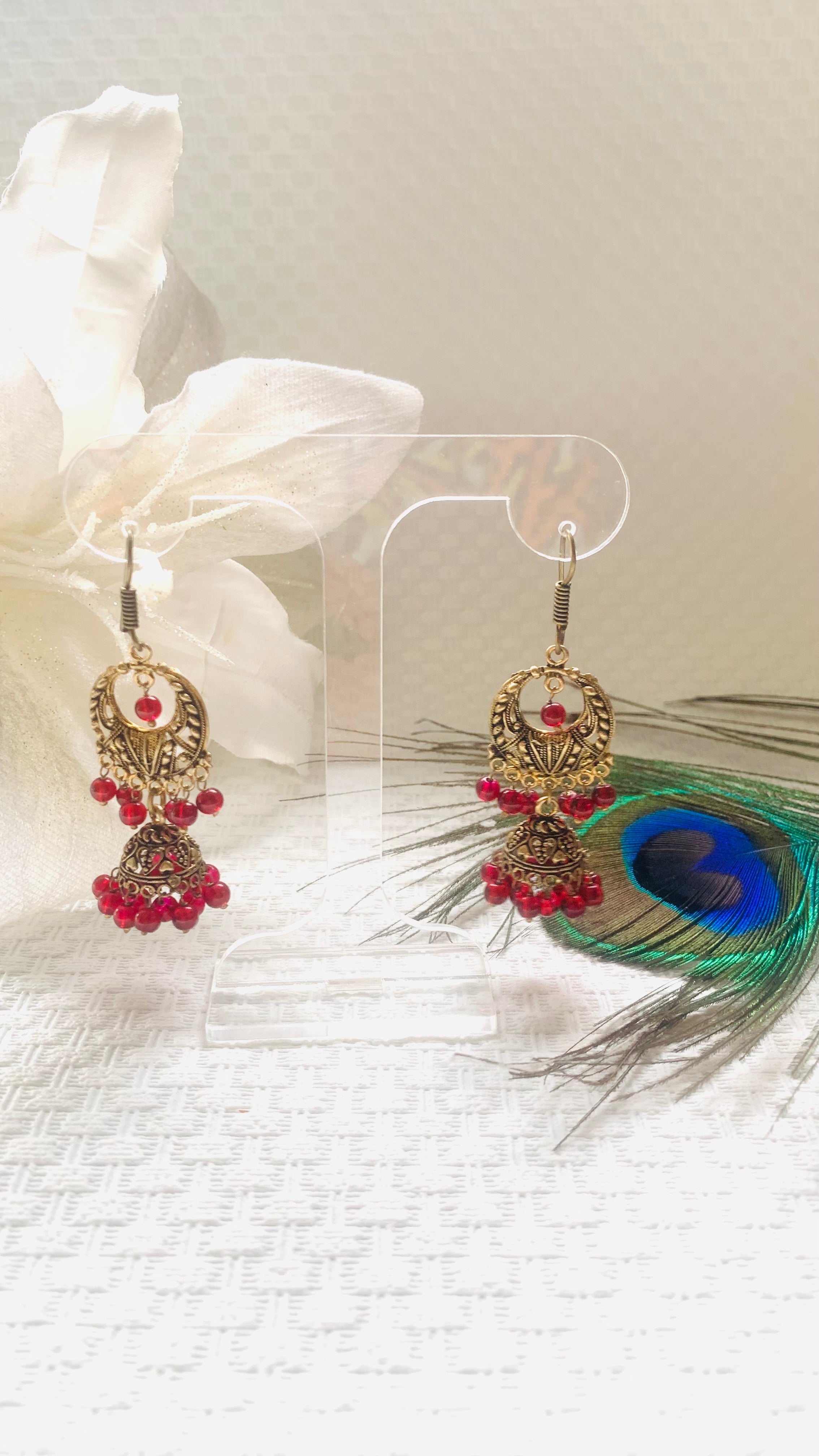 Red and antique gold jhumka earrings