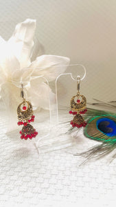 Red and antique gold jhumka earrings